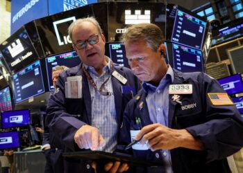 Traders work on the floor of the New York Stock Exchange Thursday.