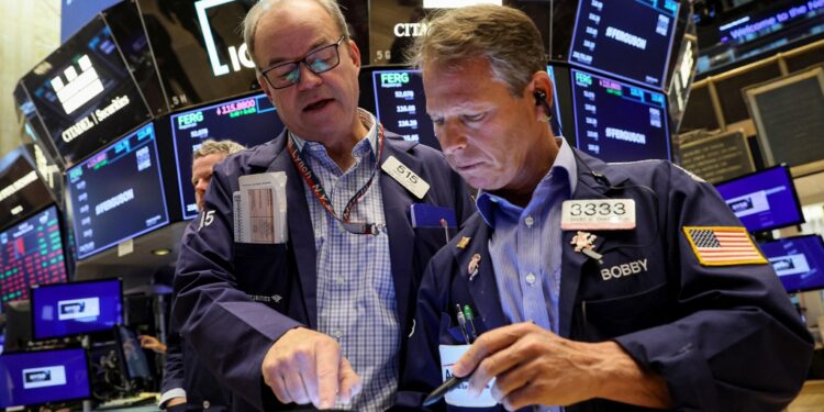 Traders work on the floor of the New York Stock Exchange Thursday.