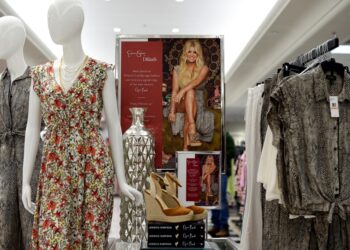 Jessica Simpson apparel on display in a department store.