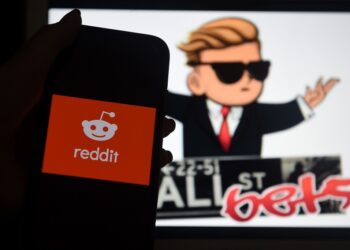 This photo illustration shows the logo of WallStreetBet on a computer and the Reddit logo.