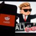 This photo illustration shows the logo of WallStreetBet on a computer and the Reddit logo.