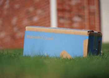 A Walmart package that has been delivered on a customer's lawn.