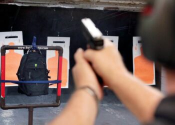 A TuffyPacks bulletproof backpack stands up to the test at a shooting range.