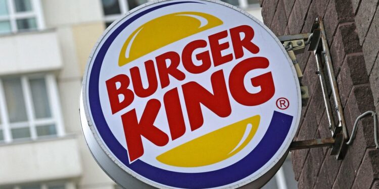 A Burger King logo is seen outside a restaurant.