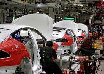 Cars move through the assembly line at Elon Musk's Tesla Motors at a factory in Fremont, Cali.