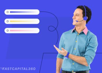 guy wearing a phone headset pointing at blocks