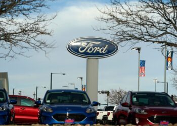 Ford sign near vehicles