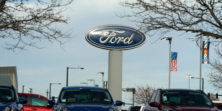 Ford sign near vehicles
