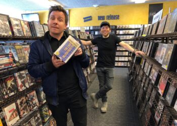 Local documentary filmmakers Taylor Morden, left, and Zeke Kamm, pose at the last Blockbuster on the planet in Bend, Ore., on Monday, March 11, 2019.