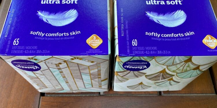 Two boxes of Kleenex tissues are displayed.