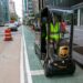 UPS worker Dyghton Anderson peddles an eQuad electric bike in a bicycle lane while delivering packages, in New York.