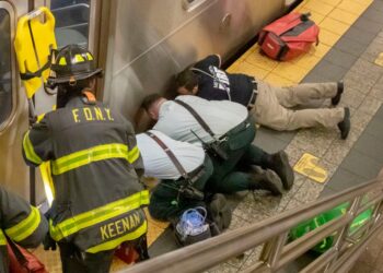 Responders working to help woman hit by a train