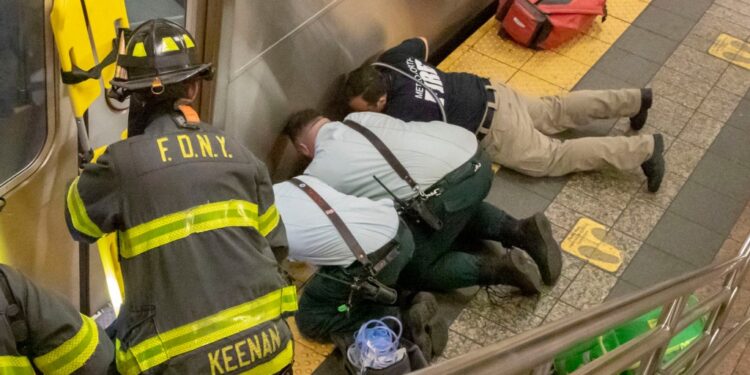 Responders working to help woman hit by a train