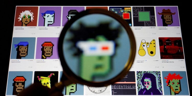 A non-fungible token (NFT) displayed on the website of NFT marketplace OpenSea is seen through a magnifying glass, in this illustration picture taken February 28, 2022.