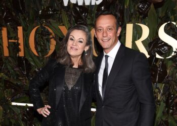 Mary Dillon with a guest at an awards ceremony.