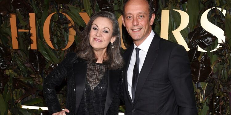 Mary Dillon with a guest at an awards ceremony.