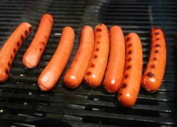Hot dogs are grilled during an Oscar Meyer promotion in New York's Times Square Tuesday, June 10, 2008.