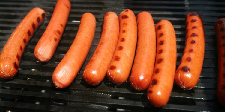 Hot dogs are grilled during an Oscar Meyer promotion in New York's Times Square Tuesday, June 10, 2008.
