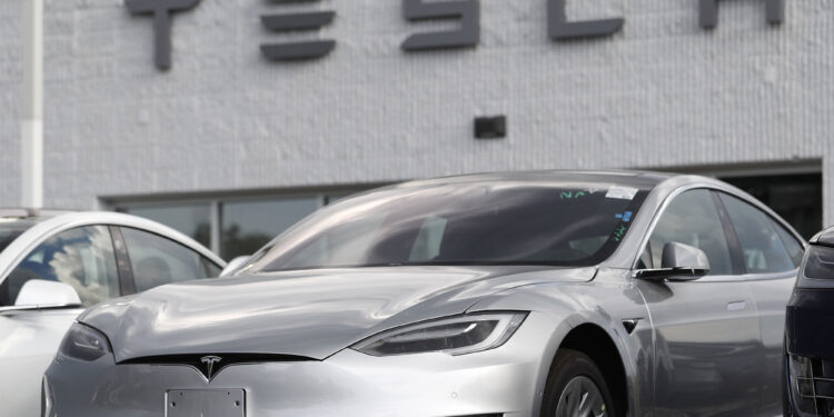 Tesla recalling over 1M cars over risk of window pinching