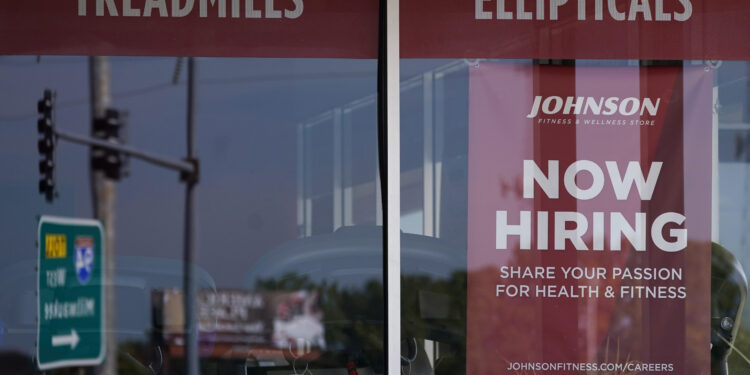 Jobless claims fell unexpectedly in still-tight labor market