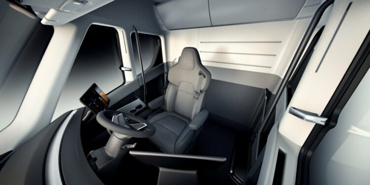 A 3-D interior view of Elon Musk's Tesla Semi electric commercial truck is displayed.