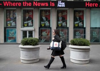 A woman walks past the News Corp. headquarters building in New York, April 19, 2017