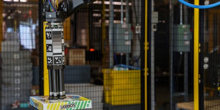 Sparrow Amazon robot picking up board game