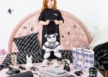 Another child holding a teddy bear.