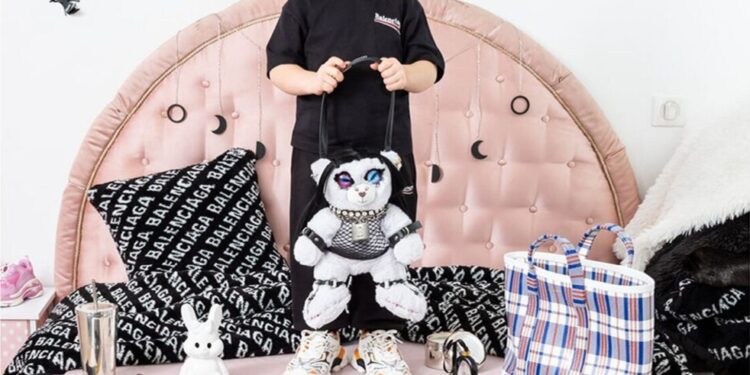 Another child holding a teddy bear.