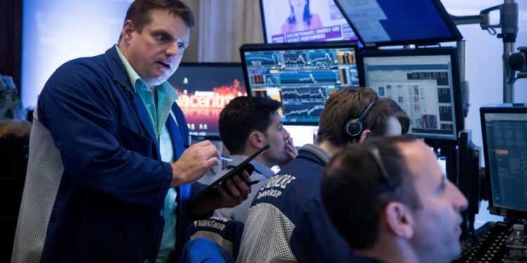 Traders work on the floor of the New York Stock Exchange