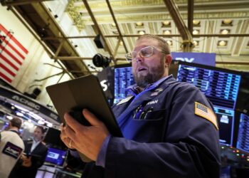 A trader works on the floor of the New York Stock Exchange Monday.