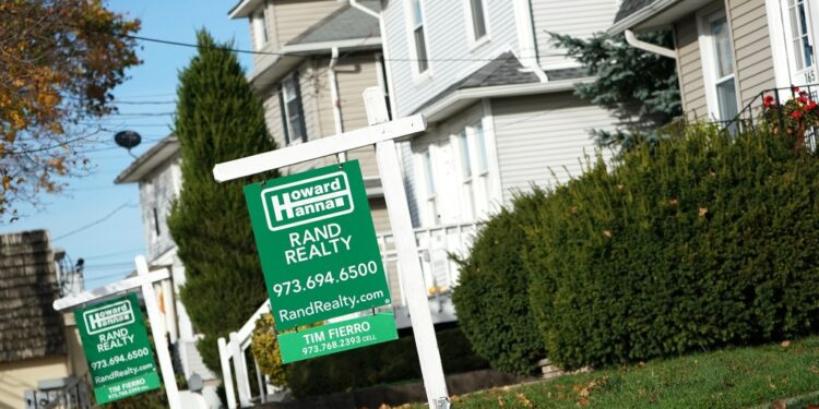 Sign advertising house for sale.