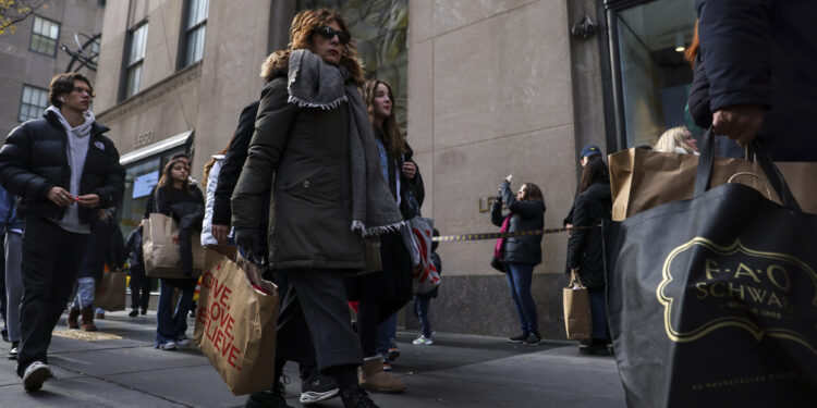 Shoppers carry bags.