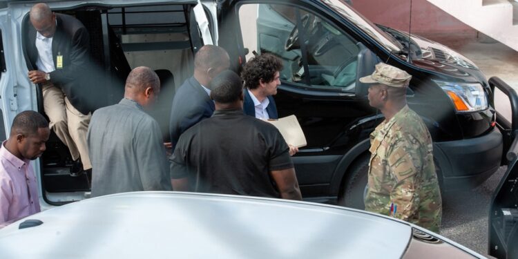 Sam Bankman-Fried leaving the Bahamas court in a black corrections van.