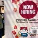 A hiring sign is displayed at a grocery store