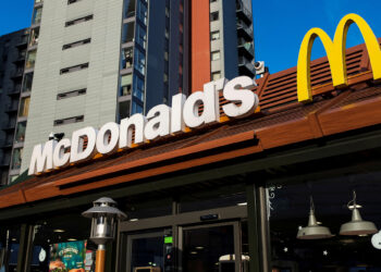 McDonald's aiming to build more stores but warns of layoffs