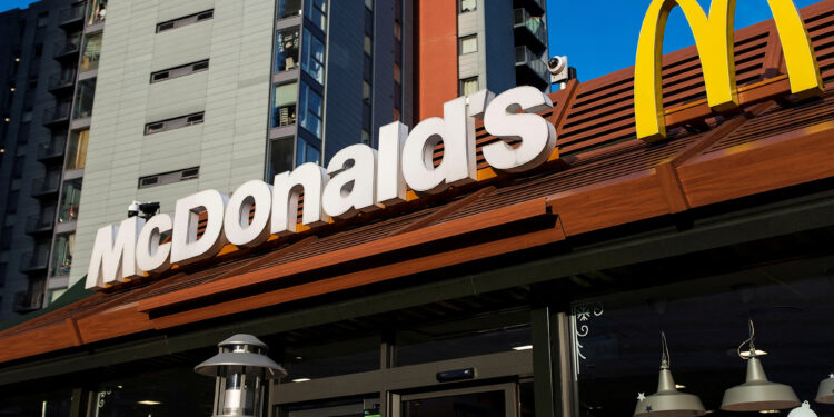McDonald's aiming to build more stores but warns of layoffs