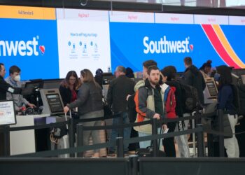 Travelers line up at the check-in counters for Southwest Airlines last week,