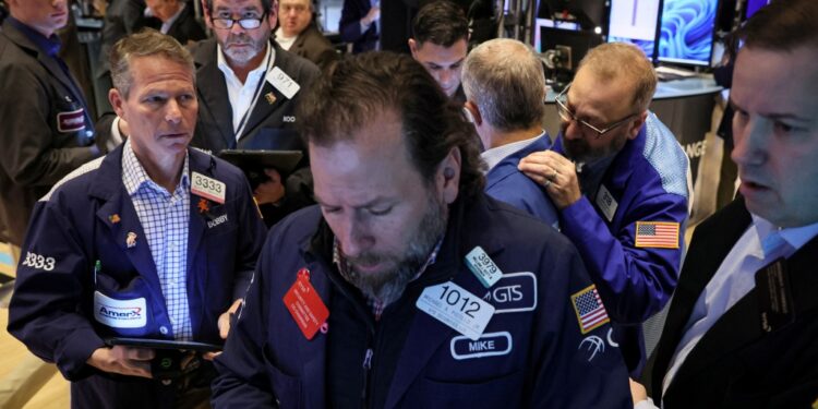 Traders work on the floor of the New York Stock Exchange.