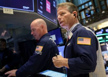 Traders work on the floor of the New York Stock Exchange.