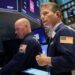 Traders work on the floor of the New York Stock Exchange.