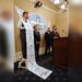 Democratic staff member William Pond, left, wears an enlarged mock-up of a receipt as Assemblyman Phil Ting, D-San Francisco, right, discusses his bill to require businesses to offer electronic receipts, in Sacramento, Calif on Jan. 8. 2019.