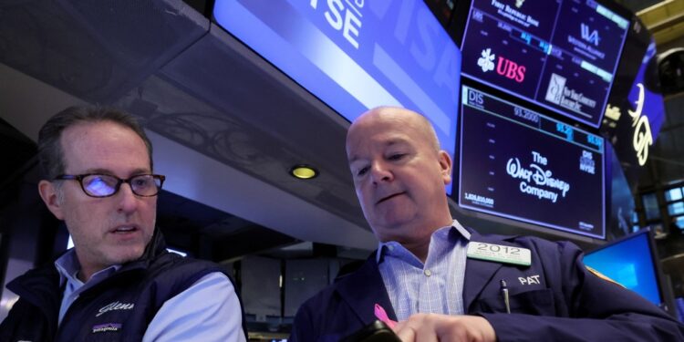 Traders work on the floor of the New York Stock Exchange Monday.