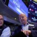 Traders work on the floor of the New York Stock Exchange Monday.