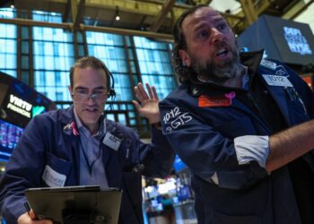 Traders work on the floor of the New York Stock Exchange Wednesday.