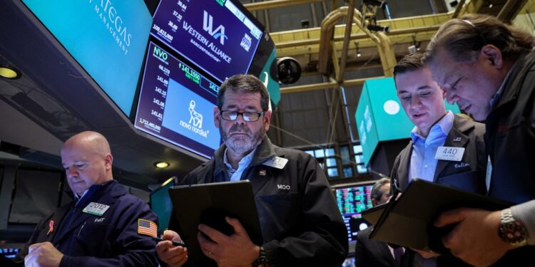 Traders work on the floor of the New York Stock Exchange on Tuesday.