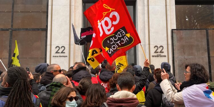 French rail workers enter LVHM headquarters.