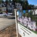 A sign announces newly built homes at a development in Sudbury, Mass.