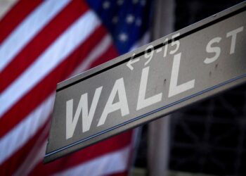 A Wall Street sign is pictured outside the New York Stock Exchange in New York.