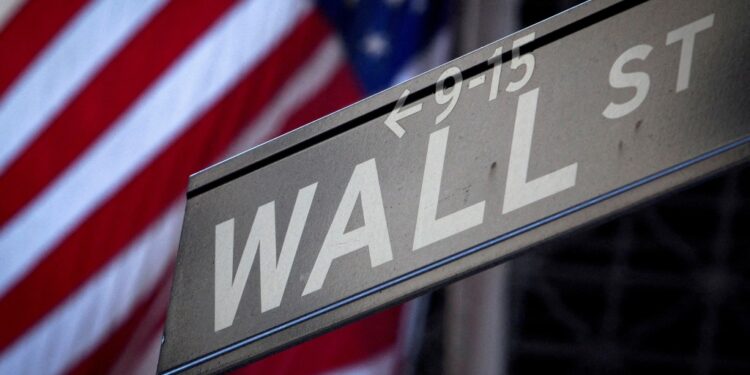 A Wall Street sign is pictured outside the New York Stock Exchange in New York.
